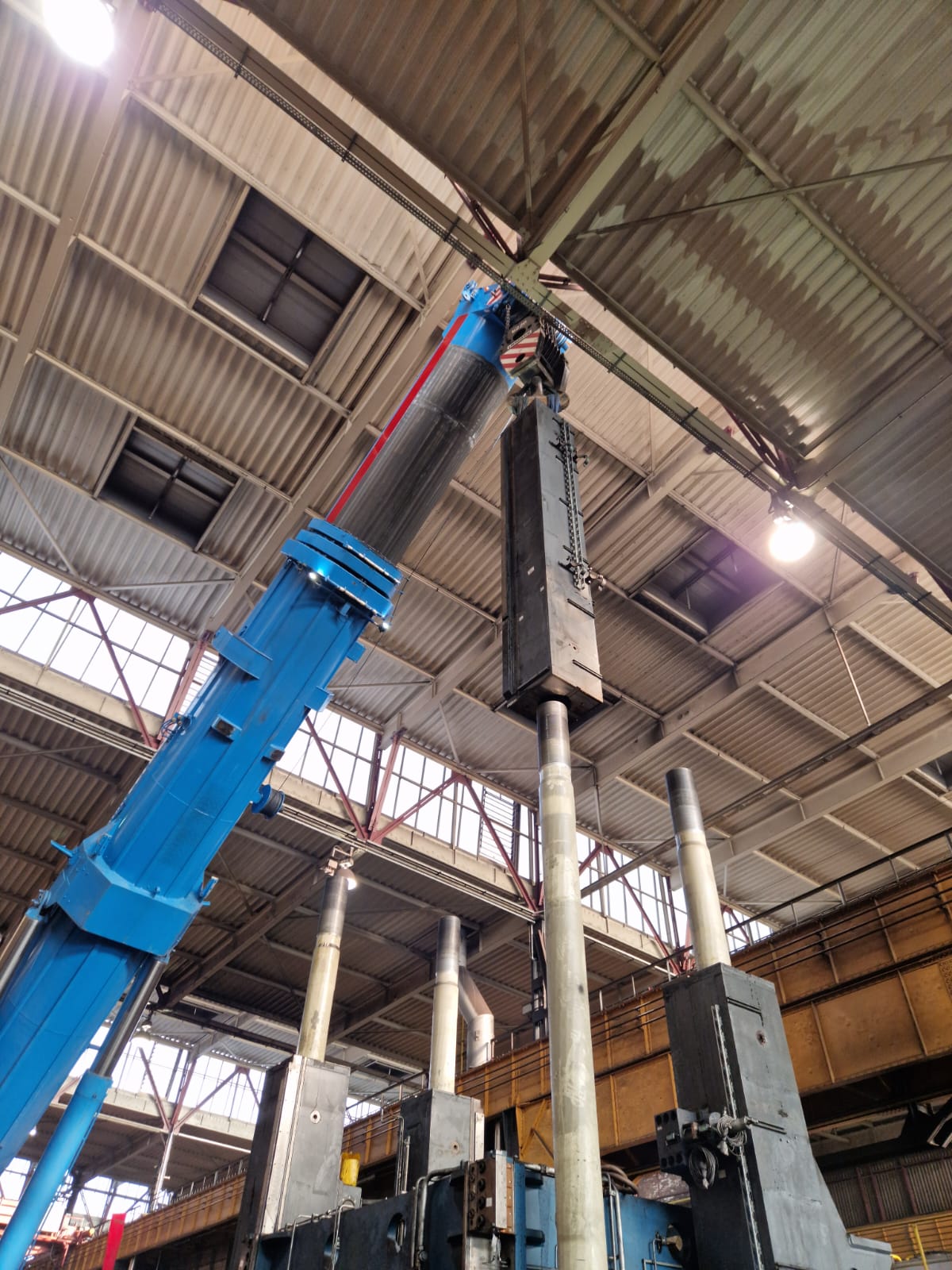 Dismantling parts of a press. Lifting parts of the press off with a crane of Gerritsen Group. 